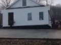 80 Men pick up and move a house_2