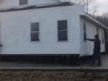 80 Men pick up and move a house_3