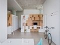 Attached storage wall to stairwell leads to mezzanine_11