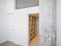 Attached storage wall to stairwell leads to mezzanine_13