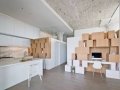 Attached storage wall to stairwell leads to mezzanine_9