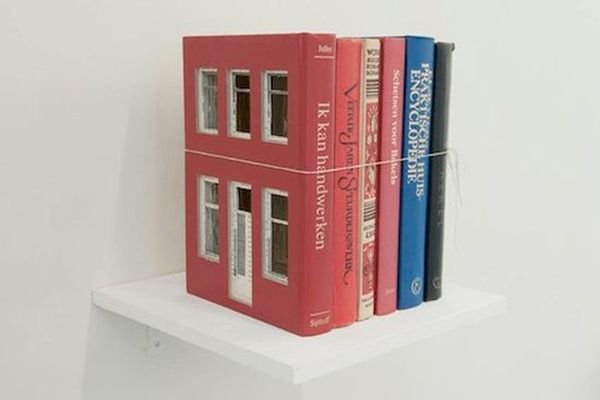 Frank Halmans carves house out of blocks of books Frank Halmans carves house out of blocks of books