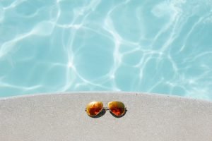 sunglasses near swimming pool