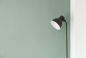 green wall with lamp